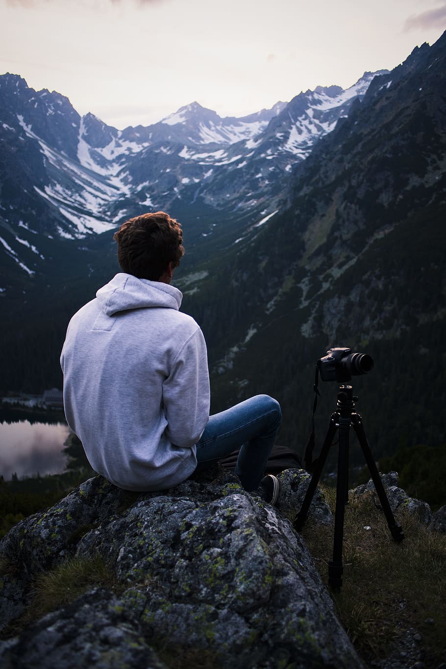 Man in Gray Hoodie Sitting on Gray Stone With Dslr Camera Tripod HD wallpaper