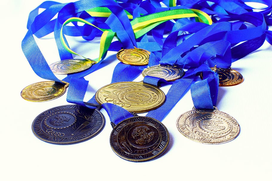 round gold-colored medal, awards, honor, merit, winner, champion