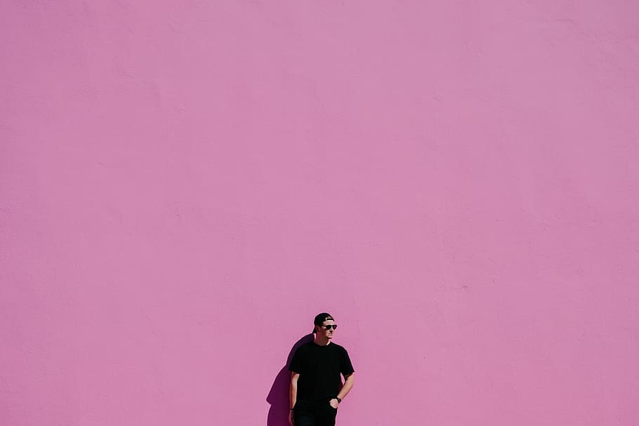 man in black shirt on pink background, man photography, men, adult HD wallpaper