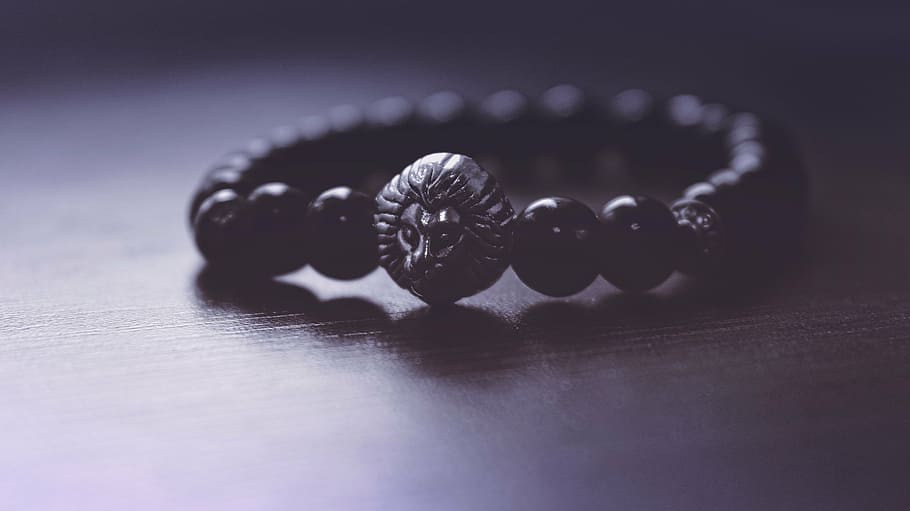beaded black bracelet on wooden surface, accessory, art, beads HD wallpaper