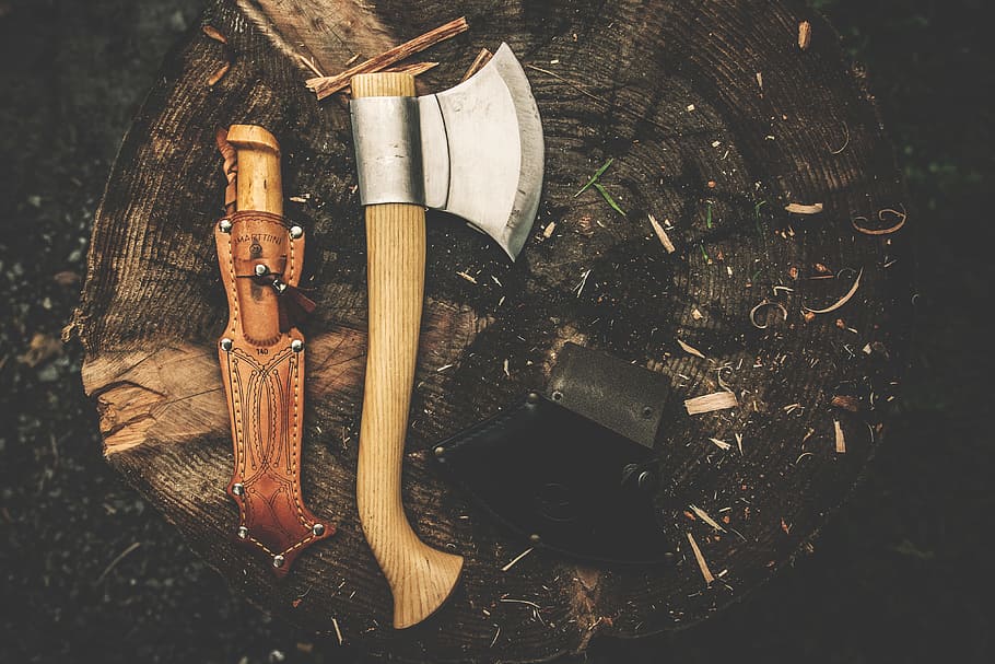 Brown Wooden Axe Besides Brown Leather Knife Holster, bushcraft