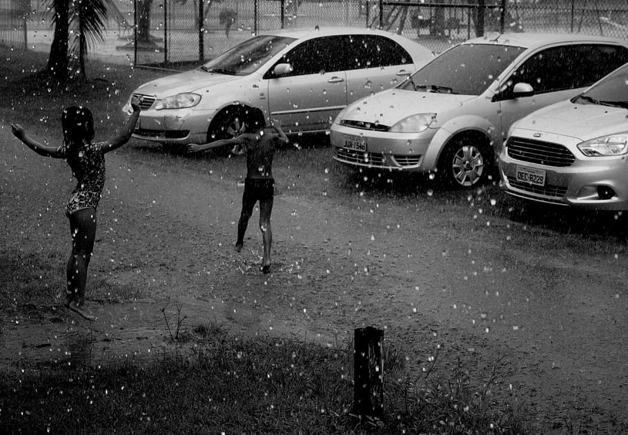 two children standing outside, rain, joke, life, love, playing