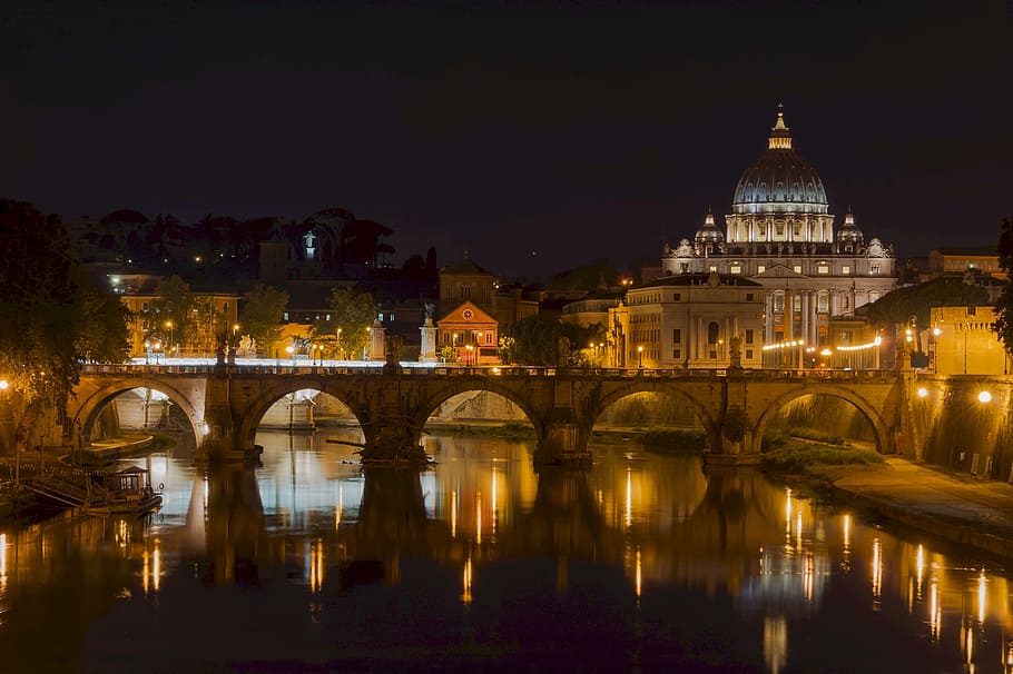 gray concrete bridge during nighttime, saint peters basilica