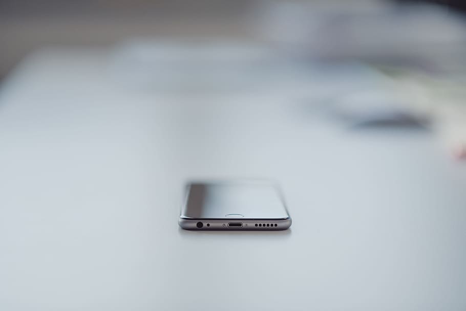 silver iPhone 6 on white table, smartphone, cell phone, mobile HD wallpaper