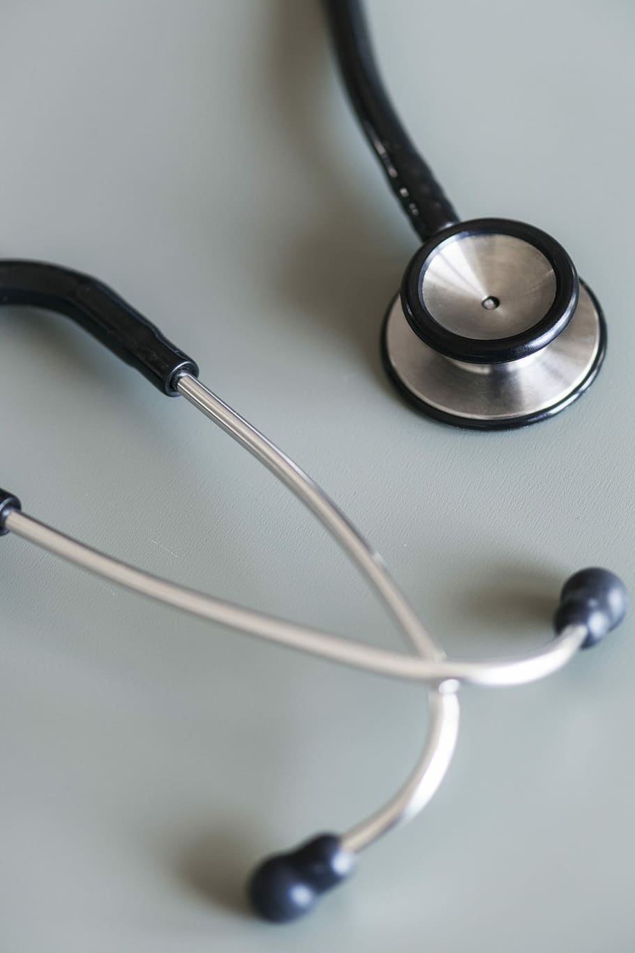 close-up photography of gray and black stethoscope, equipment