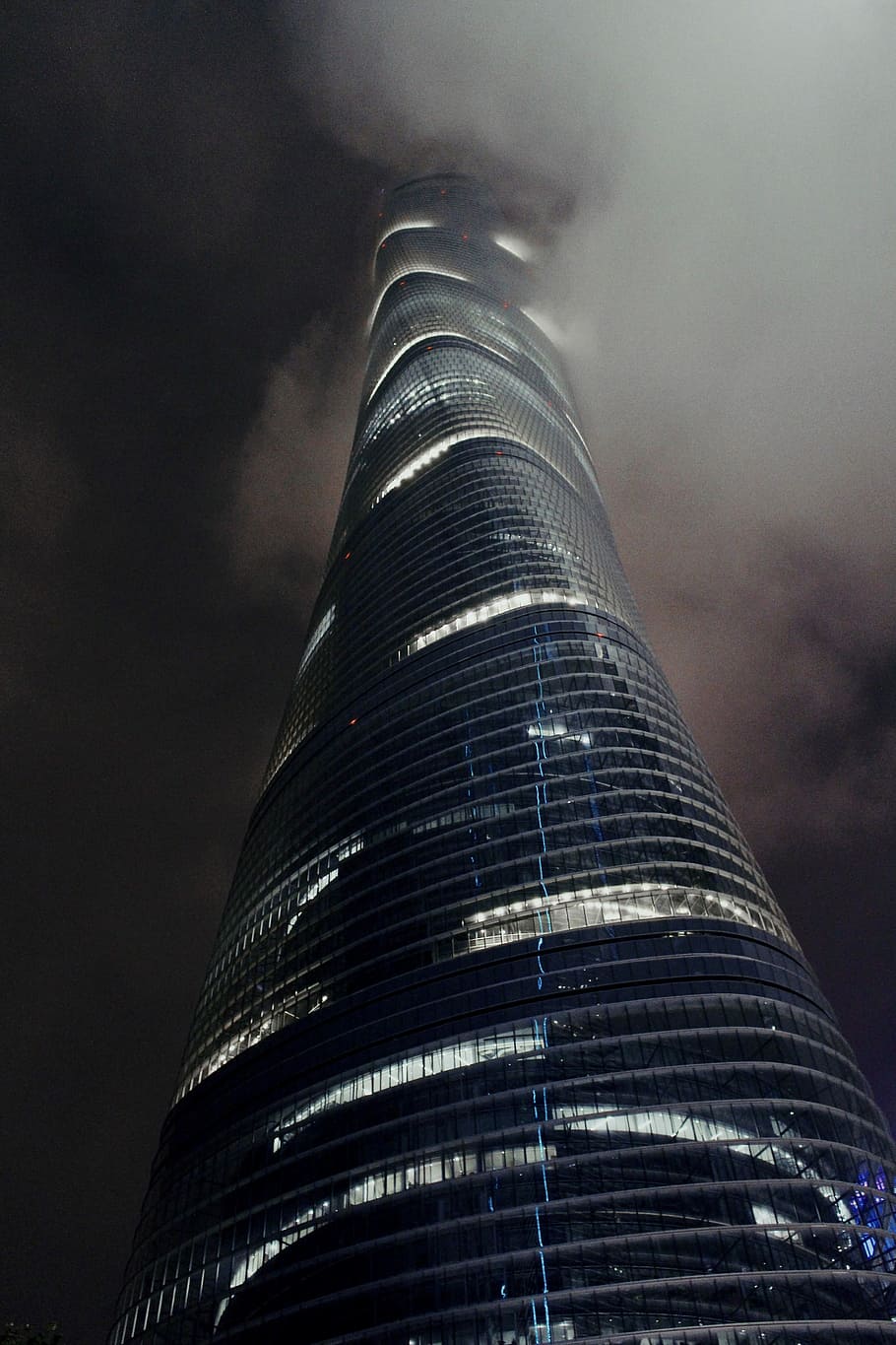low angle view of high-rise building, white smoke beside black high-rise building HD wallpaper