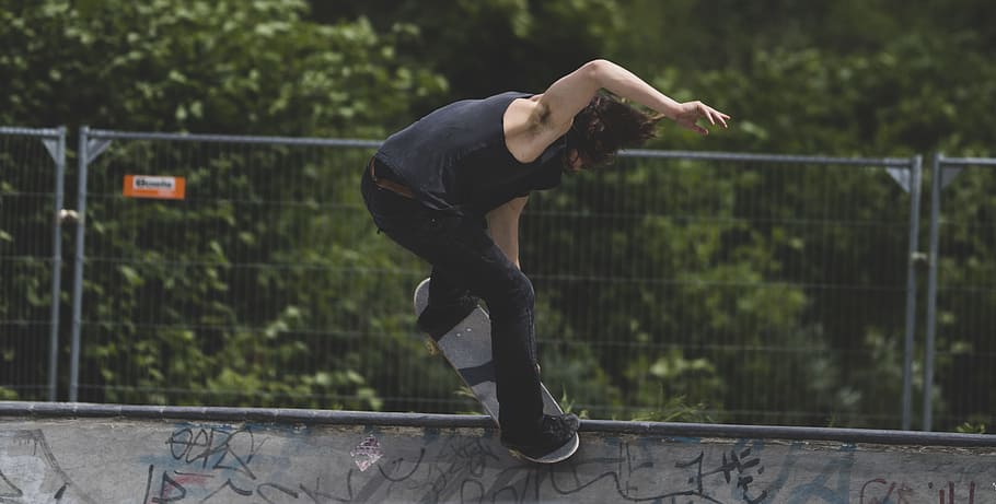 man playing skateboard, man in black tank top and pants playing skateboard HD wallpaper