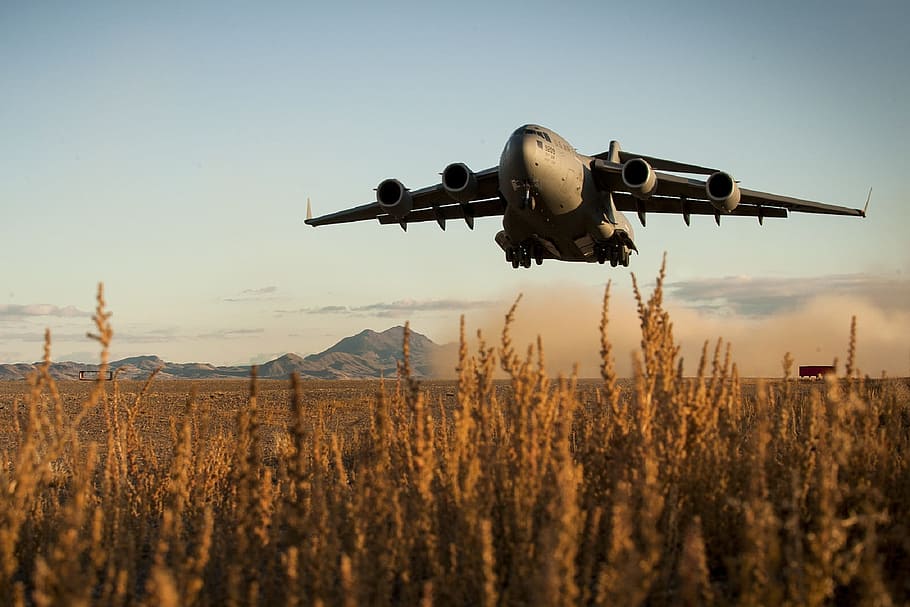 gray airplane flew above grass field at daytime, military, takeoff, HD wallpaper