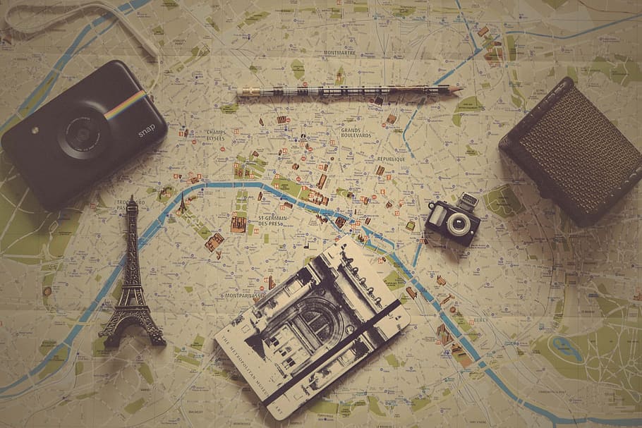 black camera near gray metal Eiffel tower figurine, eiffel tower miniature beside cameras on map board, HD wallpaper