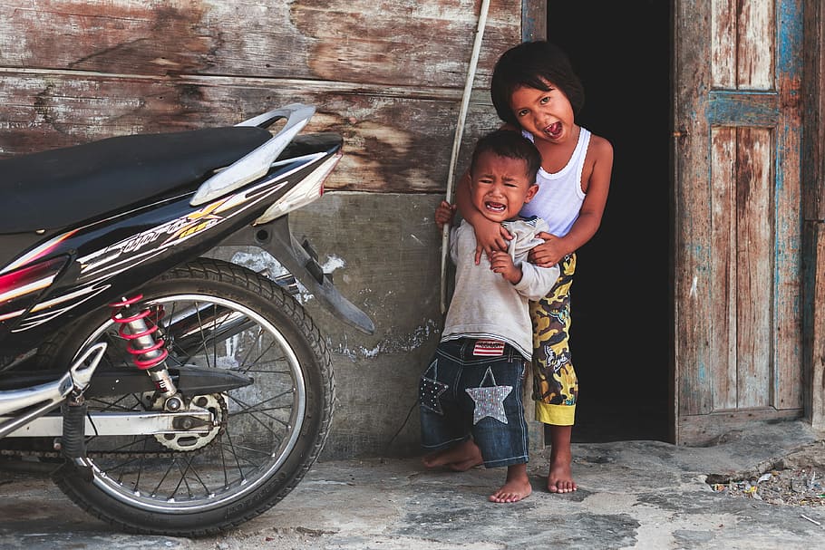 boy and girl standing near motorcycle, toddler wearing white tank top HD wallpaper