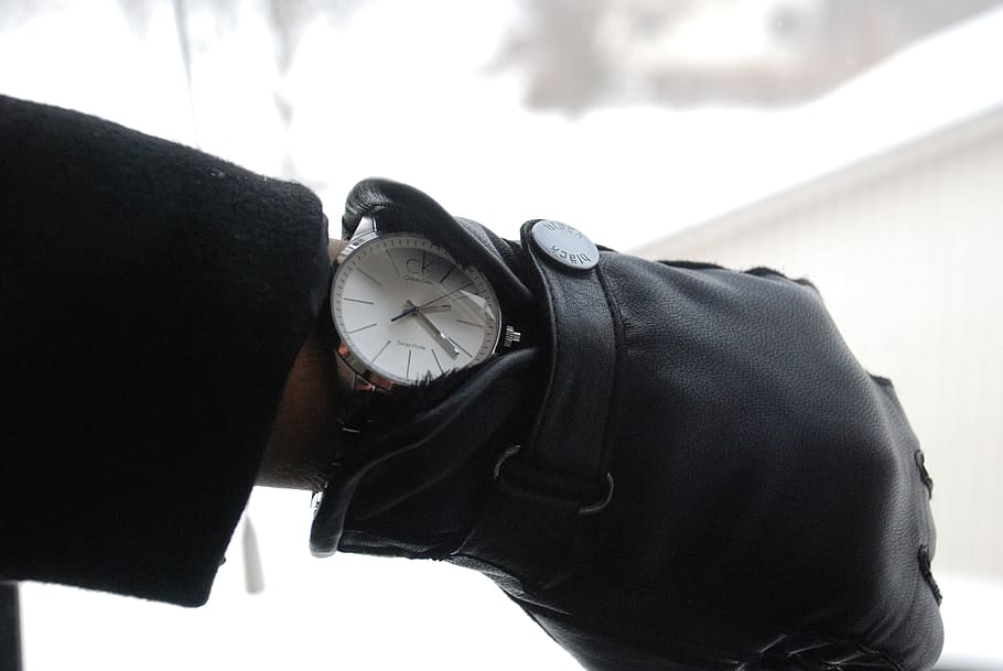 person wearing black leather glove and round black analog watch displaying 2:22 HD wallpaper