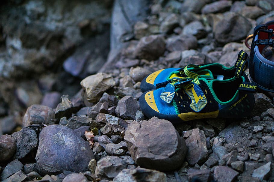 pair of green-yellow-and-blue hiking sandals on rocks, tilt, shift, HD wallpaper