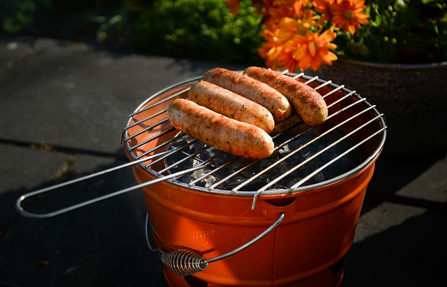 four sausages on orange grill, food, barbecue, heat, cooking, HD wallpaper