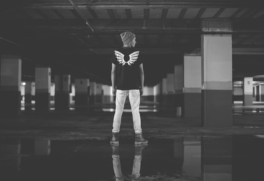 greyscale photo of man standing on concrete ground, wearing, shirt, HD wallpaper
