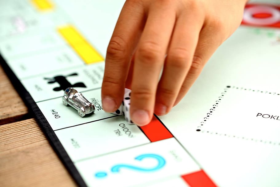 person playing monopoly holding fice, game, fun, human hand HD wallpaper