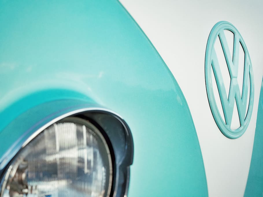 close-up photo of teal and white Volkswagen Type 1, teal and white Volkswagen vehicle in closeup photography