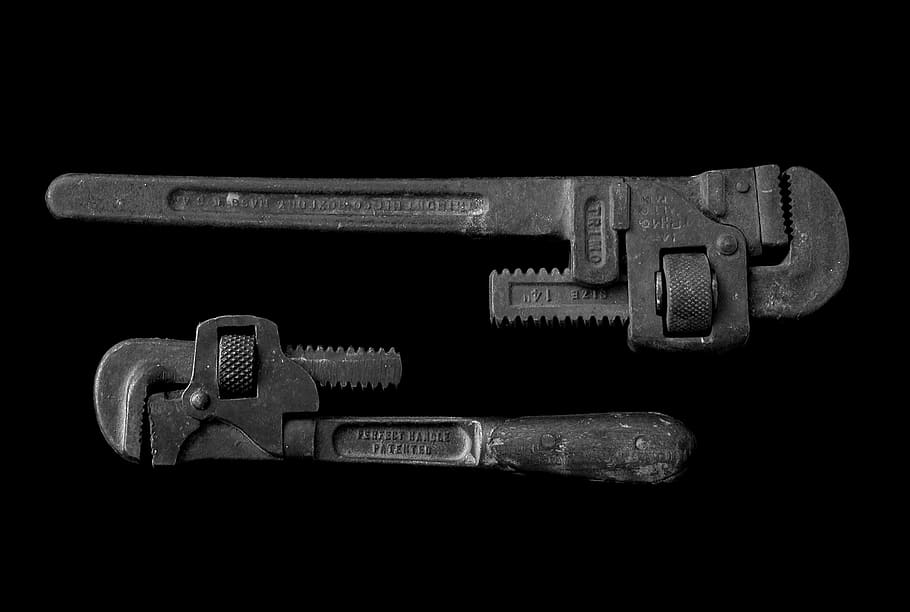 two black adjustable pipe wrenches, two gray pipe wrenches on black surface, HD wallpaper