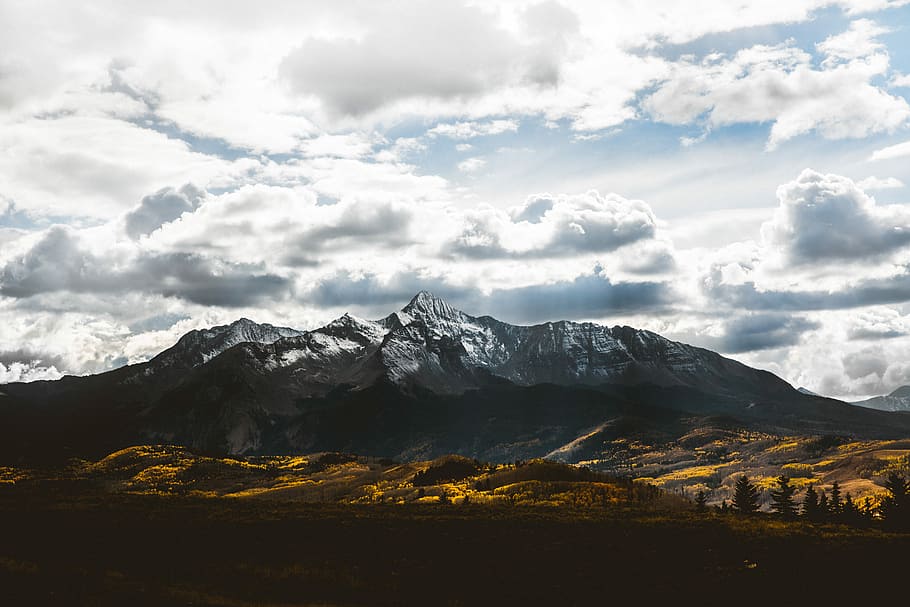 silhouette of mountain under white sky, brown mountain under white clouds HD wallpaper