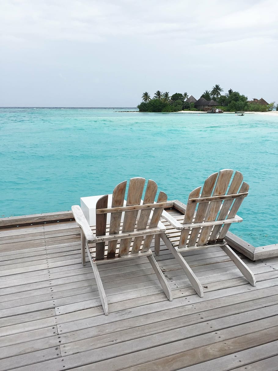 two brown wooden adirondack chairs in front ocean at daytime, HD wallpaper
