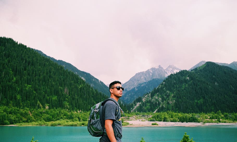 Lost in Kazakhstan, man carrying backpack, caucasian, mountain