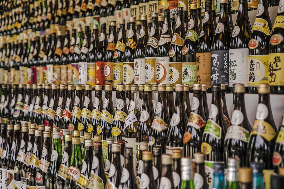 assorted-brand liquor bottle display, photo of labeled glass bottles HD wallpaper