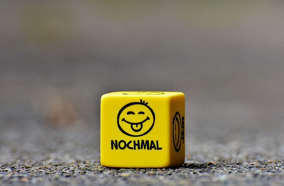 yellow printed box on ground, smiley, again, cube, funny, faces