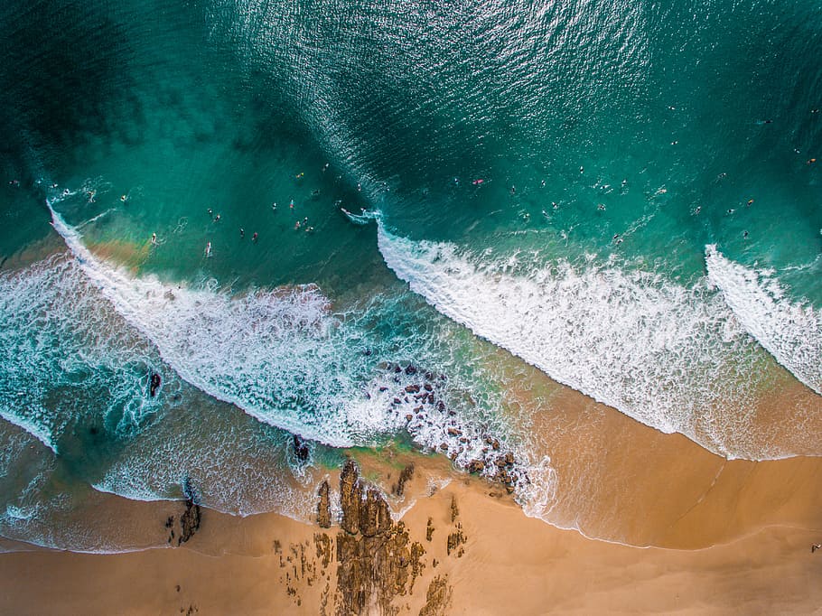 photograph of beach and sand, aerial shot of green and white body of water HD wallpaper