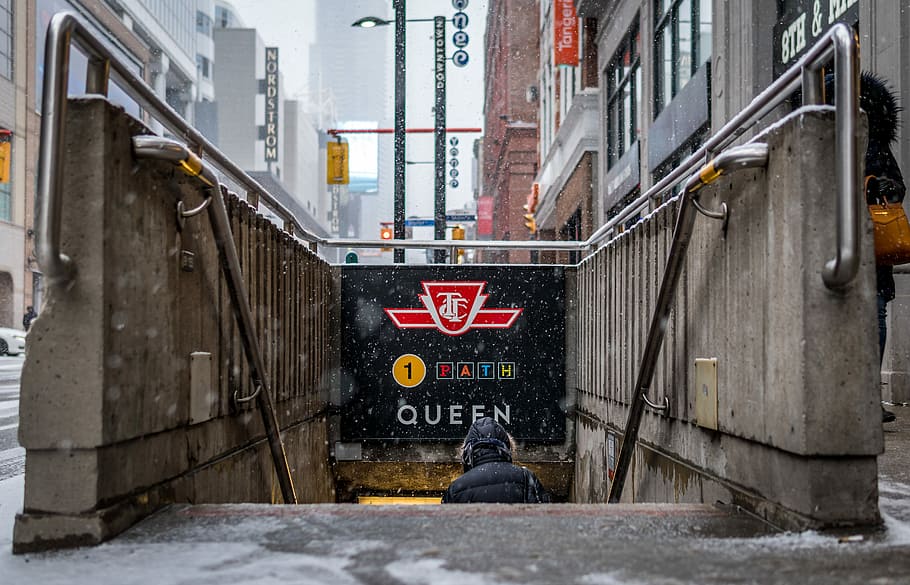 person going down to subway station, man in black hoodie on staie HD wallpaper