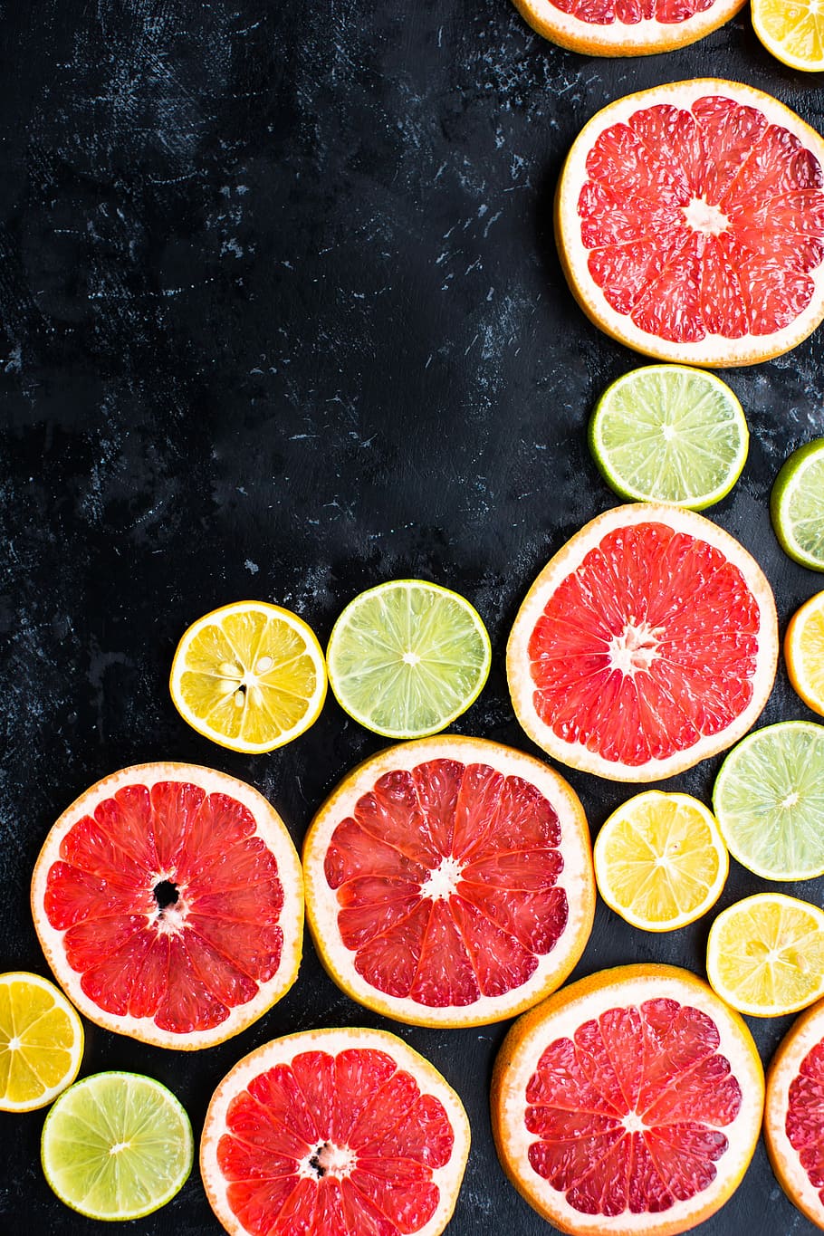 Citrus Mosaic, lemons on black surface, fruit, grapefruit, blood orange
