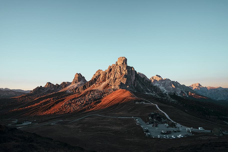 brown rock formation under blue sky, brown and gray mountains HD wallpaper