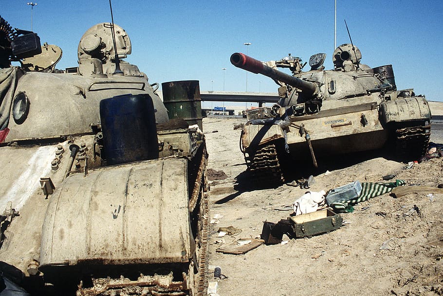 Two Iraqi tanks lie abandoned near Kuwait City in Gulf War, armor