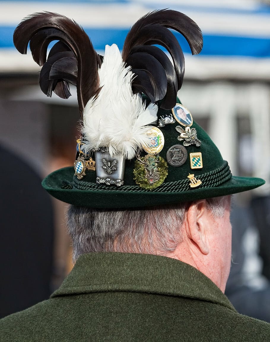 close-up photography of man's green hat and assorted badges HD wallpaper