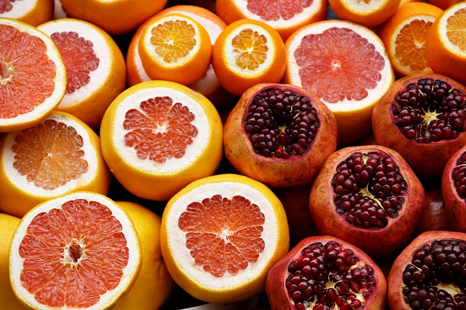 Pomegranate and orange fruits, sliced promegranate and pomelo HD wallpaper