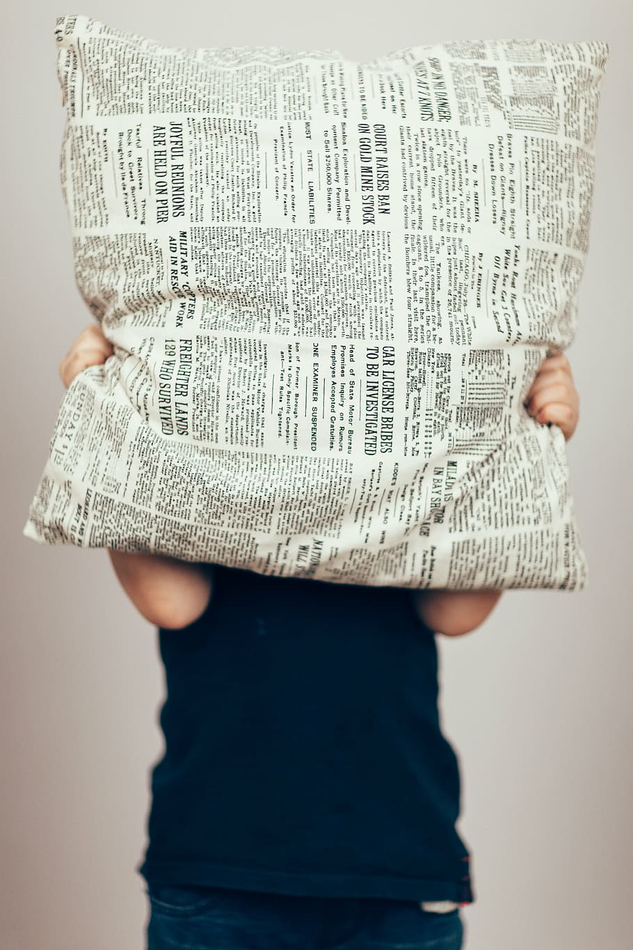person covering face with white and black printed pillow, decor HD wallpaper