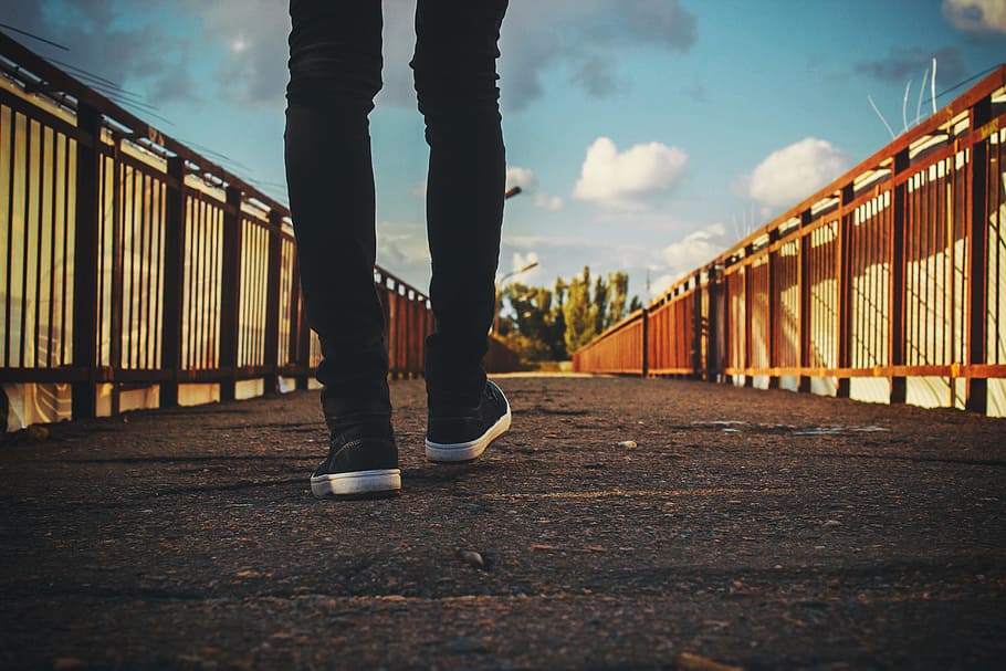 feet, walking, bridge, shoes, railings, low section, sky, one person