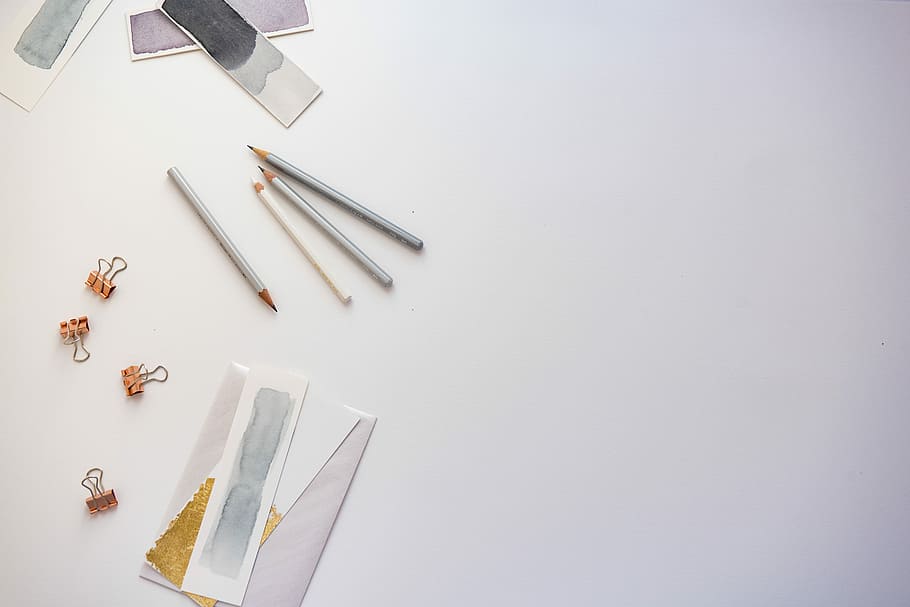 high angle photo of four pencils and greeting card, gray pencils near clips and envelope HD wallpaper