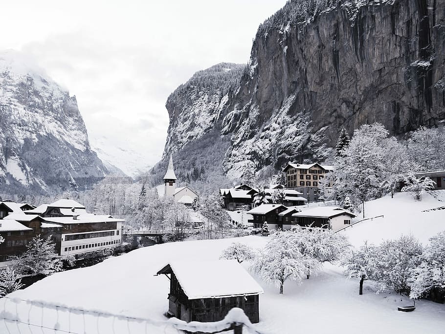 village during snow season, photo of mountain range beside houses HD wallpaper