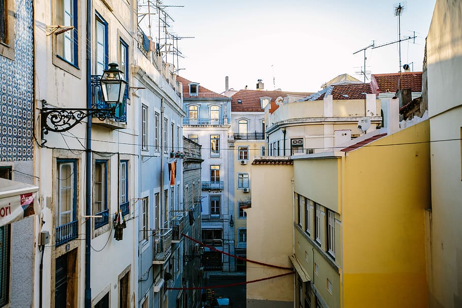 yellow and white building at daytime, white and yellow concrete buildings HD wallpaper