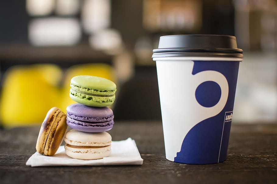 macaroons on tissue beside coffee cup, pile of pastries beside mug HD wallpaper