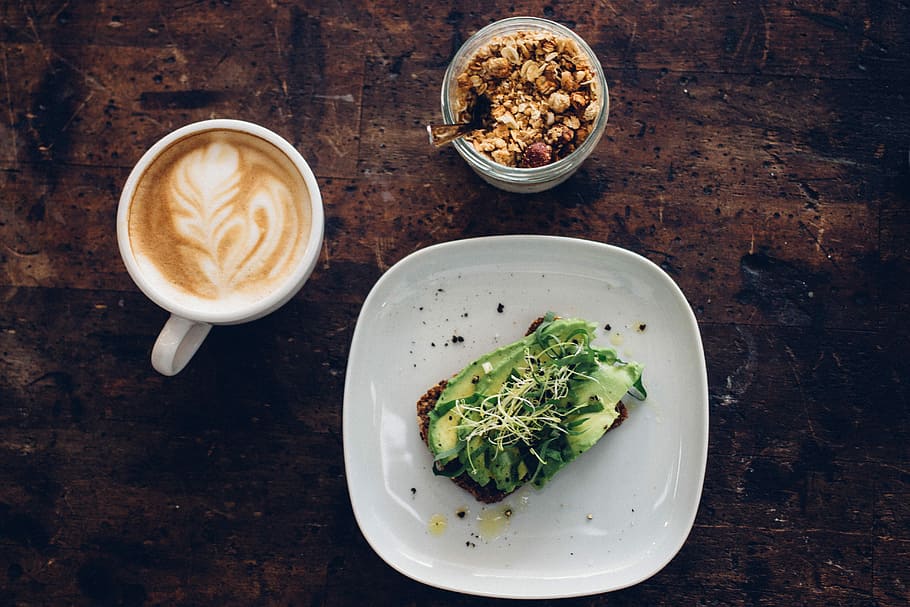 sliced vegetable on plate near coffee cup and nuts on glass container, vegetable dish on white ceramic plate HD wallpaper