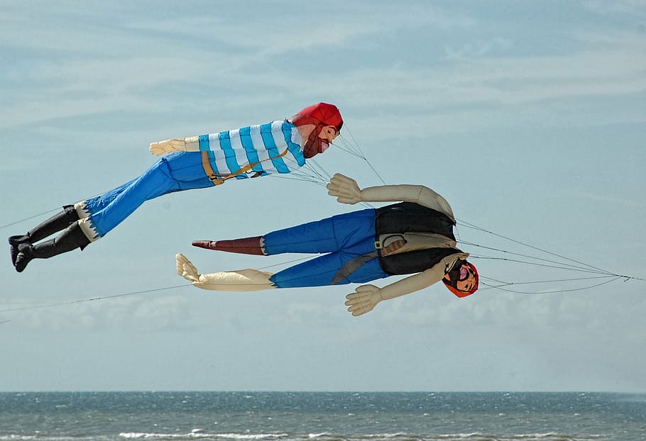 two inflatable human figure kite floatings, beach, berck-plage HD wallpaper