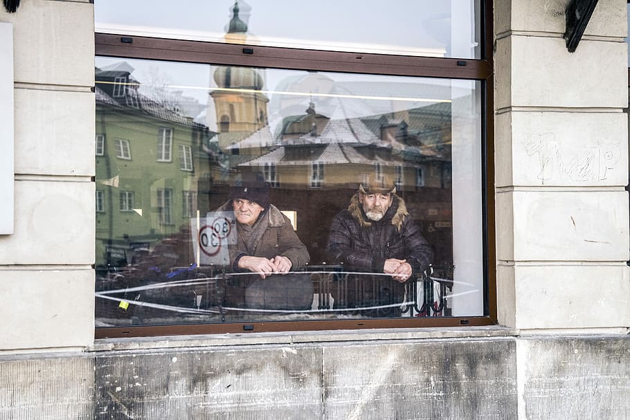 two men standing beside window, two man leaning in front of window HD wallpaper
