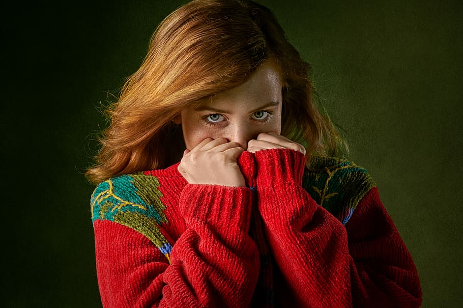 woman covering mouth with sweater, photo of woman wearing red sweater covering face, HD wallpaper