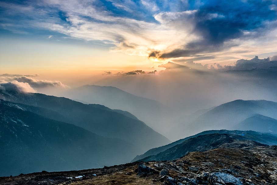 mountains covered with fog during daytime, brown mountain during daytime HD wallpaper