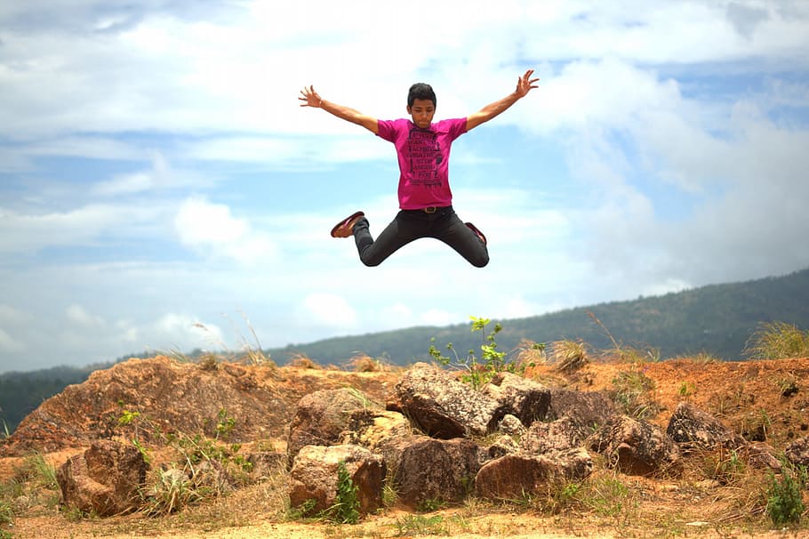 jump shot of man wearing purple shirt, boy, happy, fun, young HD wallpaper