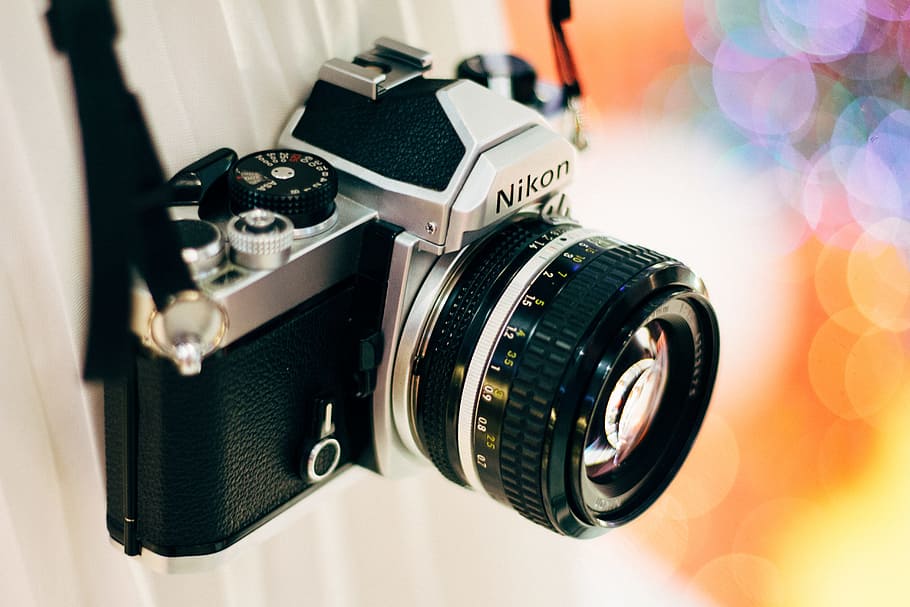 black Nikon DSLR camera, bokeh photography of gray Nikon film camera HD wallpaper