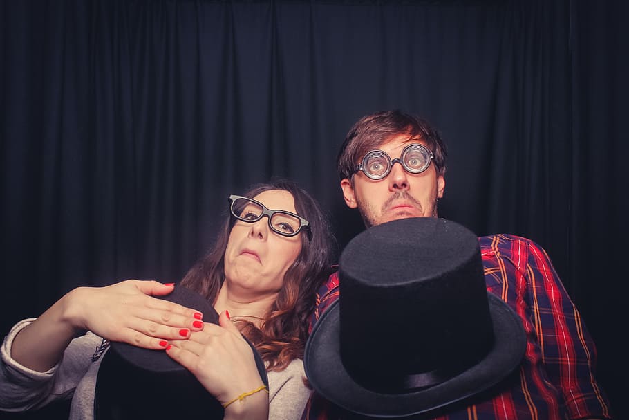 two woman making face near black curtain, geek, magic, fun HD wallpaper