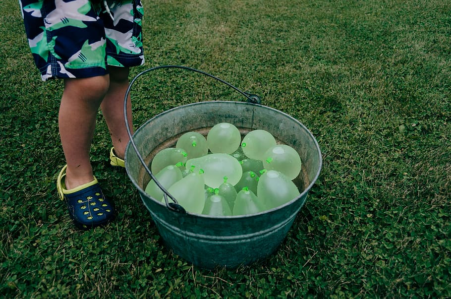 green balloons on gray stainless steel bucket, child standing beside blue metal container, HD wallpaper