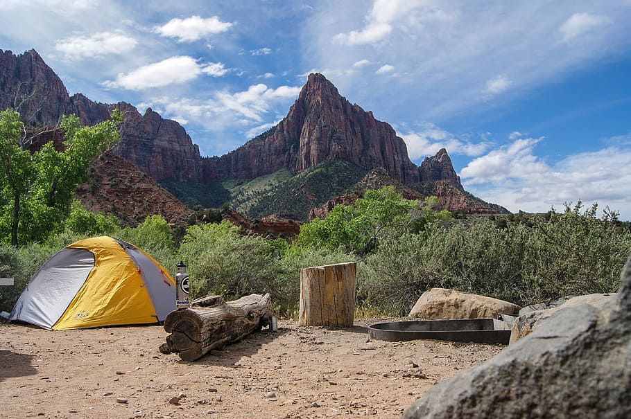 yellow and gray dome tent near tree stump with rocky mountain under cloudy sky, yellow and gray tent near trees beside mountain HD wallpaper
