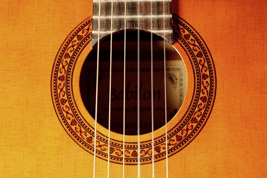 closeup photo of brown guitar, ropes, instrument, music, wood